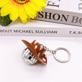 Silver disco ball keychain with brown cowboy hat on white desk with sunflower - Brown and White Cowboy Hat / 3cm Mirror Ball