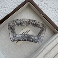 Close-up of a large transparent acrylic hair claw clip with elegant black lace mesh patterns - Flat Square / Black
