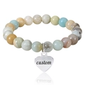 Pink zebra stone beaded bracelet with custom engraved silver heart charm on white base - Amazonite