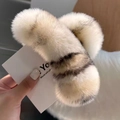 Macro detail of plush faux rabbit fur claw clip featuring soft cream and brown stripes - Ivory (Large)