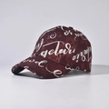 Detailed close-up of wine red baseball cap featuring silver cursive street art patterns - Adjustable / Burgundy