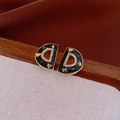 Close-up of vintage gold D-letter earrings with black enamel and sparkling zircons - Black (Silver Earring Post)