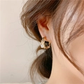 Elegant gold-plated hoop earring featuring white flowers and clear beads on a female model - Gold E709 White Flower Hoop