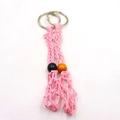 Detail of two handmade pink woven net keychains with adjustable wood bead accents - 2 Pcs/Set / Pink