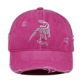Close-up of pink distressed baseball cap with white dinosaur skeleton embroidery. - Rose Red