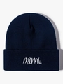Detail view of navy blue knitted beanie with white mimi script embroidery on the cuff - Navy Blue