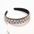 Close-up of rhinestone leaves and marquise gems on Baroque padded headband - Pearl White