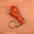 Realistic fried chicken leg keychain with crispy texture on a wooden background - Chicken Leg - Keychain Style