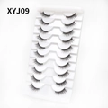 Close-up of 10 pairs of XYJ09 cat-eye false eyelashes in a white plastic tray - Curled Voluminous Style (XYJ09) / 10 Pairs Set