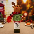 Detail of knitted Christmas reindeer wine bottle cover with festive red scarf and green buttons - Reindeer Wine Bottle Cover