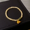 Beaded bracelet with yellow crystal rounds, green accents and golden gourd pendant - 65# Gold Hulu