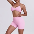 Detail of light pink racerback sports bra and high-waisted shorts yoga set - XS / Barbie Pink