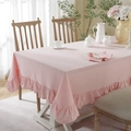 Close-up of pink cotton tablecloth featuring ruffled lotus edges and natural washed texture - Pink Ruffle Edge