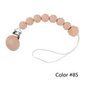 Silicone and beech wood pacifier clip with dusty pink beads and wooden clasp in color 85 - Style 85 Red/Blue Stripes