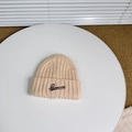 Detail of beige ribbed knit beanie with Pensecolo embroidery on a white decorative plate - One Size (3-8 Years) / Beige