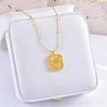 Elegant gold square pendant necklace with rose embossing on a thin beaded chain - Square Plate Flower