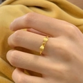 Bowtie wheat-ear ring in 18K gold plated matte finish shown on a warm plush texture - Bowknot (Heart Center) Adjustable