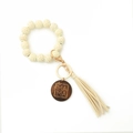 Detail of leopard print silicone beads with Mama engraved wooden disc and leather tassel - White