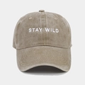 Close-up of STAY WILD embroidery on washed cotton baseball cap with curved brim - Adjustable / Khaki