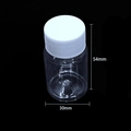 Transparent plastic storage bottle 30mm x 54mm with white screw cap on black background - 20ml Clear Screw Cap Bottle