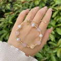Detail of adjustable 18k gold plated bracelet with pearls, pink quartz and coin charm - Virgin Mary Pendant / Pink Natural Stone / Pink