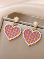 Elegant C-hoop earrings featuring purple checkered heart charms and pearl trim - Purple Orange Checker (7610)