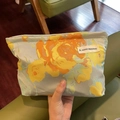 Grey canvas makeup bag featuring large yellow and orange floral patterns with zipper closure - Oil Painting Style Blue