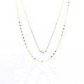 Close-up of double-layer gold necklace with light green gemstone on white background - Green Aventurine