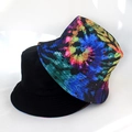 Detail view of foldable reversible bucket hat with galaxy print and plain black cotton - Colorful Spotted Tie Dye