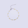 Detailed macro view of silver lip chain with yellow enamel beads and adjustable clasp - Steel + Yellow