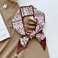 Green and burgundy geometric pixel silk scarf tied on a brown shirt collar stylishly - Caramel Pop Art Style