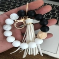 Silicone wristlet keychain featuring black agate beads, wooden bead and leather tassel - White