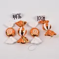 Detailed view of 10cm orange Christmas candy ornaments with glitter swirls and stripes - Set 08 (Orange & White Candy 10cm - 4pcs)