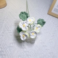 Handmade crochet pansy flowers in white and yellow yarn with green leaves for home decor - Creamy Yellow