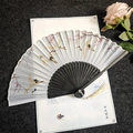 Classic folding fan with crane pattern, black carved ribs and long white tassel - Crane Dance - Black Handle