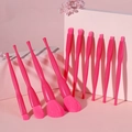 Detailed view of pink makeup brushes set arranged on pink geometric steps with floral decor - 11Pcs in OPP Bag / Rose Pink