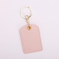 Detailed view of pink PU leather access card holder with gold keychain ring - Square / Sakura Pink