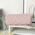 Detail of pink quilted pencil case featuring soft texture and smooth metal zipper closure - Lotus Pink