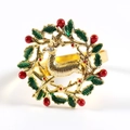 Golden Christmas napkin ring featuring a festive reindeer with a green berry wreath - Wreath Deer 1