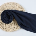 Dark blue chiffon hijab scarf with neat rolled edges on a woven straw coaster - 119