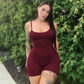 Close-up of wine red slim fit romper with spaghetti straps and ruched fabric texture - Burgundy