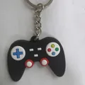 Classic black silicone retro gamepad keychain featuring colorful gaming buttons - Black Blue Cross