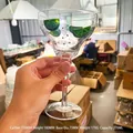 Hand-painted Margaret cocktail glass with lime slices and dots on clear glass body - New Lemon