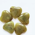 Five yellow-green polished heart-shaped crystals with natural texture on white background - Yellow Green Stone (1)