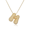 Gold plated initial pendant necklace featuring peanut design with clear crystals - Letter M