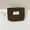 Detailed macro view of the wool plaid cosmetic organizer bag with green and brown patterns - Woolen Style / Red and Green Plaid