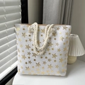 White canvas tote bag featuring gold star prints and rustic beige hemp rope handles - Gold Star