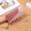 Portafoglio lungo da donna bicolore con cerniera, cinturino da polso e nappa - Rosa