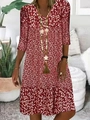 Detail of V-neckline and floral print on a burgundy midi dress with mid-length sleeves - S / Tops / Red