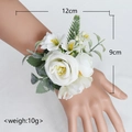 Elegant white rose wrist corsage with green leaves for weddings and ceremonies - Wrist Corsage / Ivory